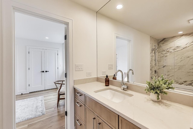 2128 Scotch Pine Ln, Northbrook, IL 60062 - full bathroom featuring a stall shower, wood finished floors, recessed lighting, and vanity