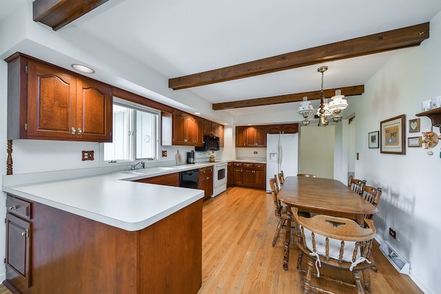 1405 N W St, Naperville, IL 60563 - kitchen with black appliances, a sink, a peninsula, light wood finished floors, and a chandelier
