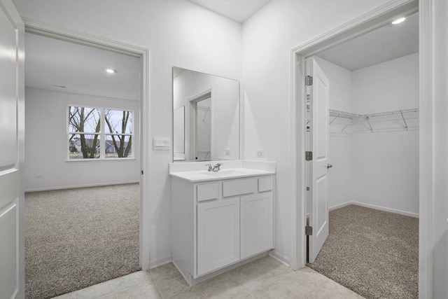 2601 Harnish Dr, Algonquin, IL 60102 - bathroom with a spacious closet, vanity, and baseboards