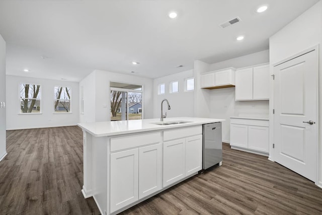2601 Harnish Dr, Algonquin, IL 60102 - kitchen featuring stainless steel dishwasher, a sink, dark wood finished floors, a center island with sink, and white cabinets