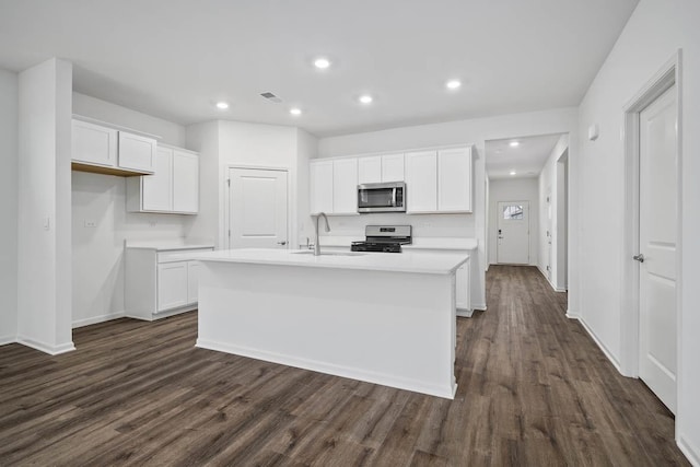 2601 Harnish Dr, Algonquin, IL 60102 - kitchen with appliances with stainless steel finishes, a sink, dark wood-style flooring, white cabinets, and recessed lighting