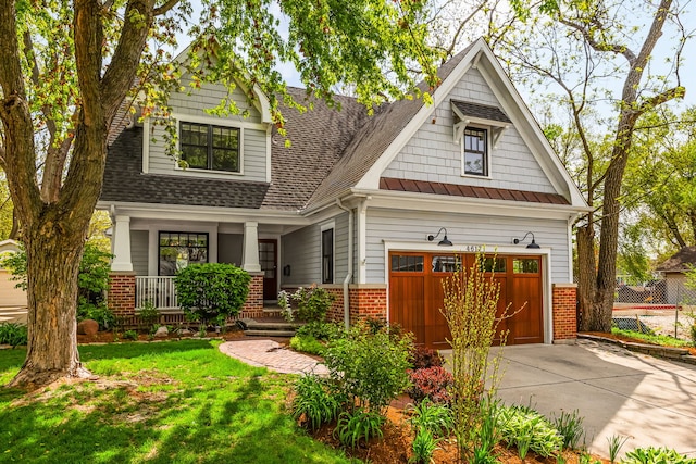 4617 Linscott Ave, Downers Grove, IL 60515 - craftsman-style house with brick siding, driveway, a porch, a shingled roof, and a front lawn