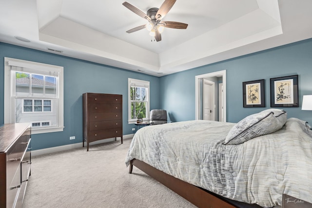 4617 Linscott Ave, Downers Grove, IL 60515 - bedroom featuring a tray ceiling, carpet floors, and a ceiling fan