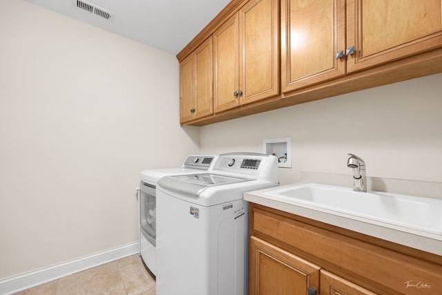 4617 Linscott Ave, Downers Grove, IL 60515 - washroom featuring independent washer and dryer, cabinet space, and light tile patterned flooring