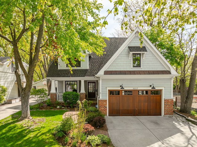 4617 Linscott Ave, Downers Grove, IL 60515 - craftsman house featuring brick siding, a porch, driveway, a front lawn, and a shingled roof