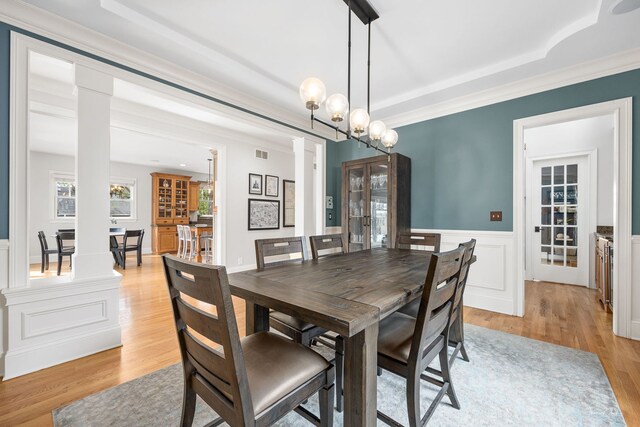 4617 Linscott Ave, Downers Grove, IL 60515 - dining room featuring decorative columns, light wood finished floors, a wainscoted wall, a chandelier, and french doors
