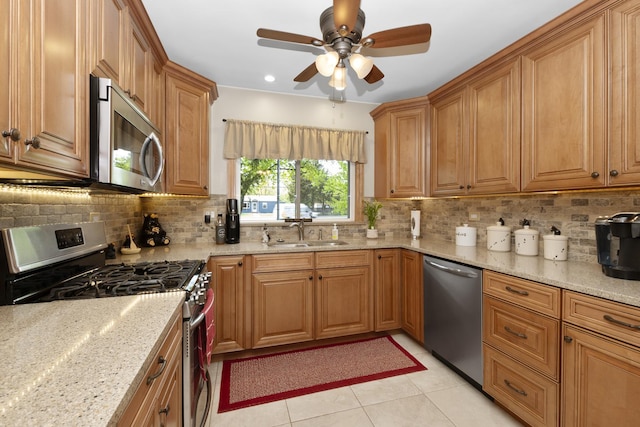 5400 Midlothian Tpke, Crestwood, IL 60418 - kitchen with stainless steel appliances, a sink, ceiling fan, light stone countertops, and decorative backsplash