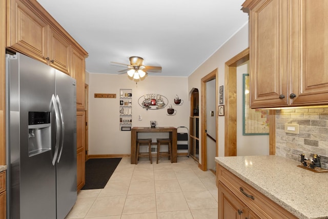 5400 Midlothian Tpke, Crestwood, IL 60418 - kitchen featuring stainless steel refrigerator with ice dispenser, tasteful backsplash, arched walkways, ceiling fan, and light stone counters