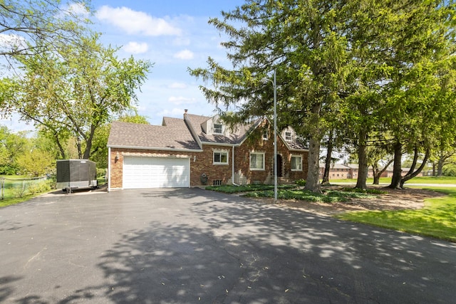 5400 Midlothian Tpke, Crestwood, IL 60418 - tudor house with brick siding, roof with shingles, an attached garage, and driveway