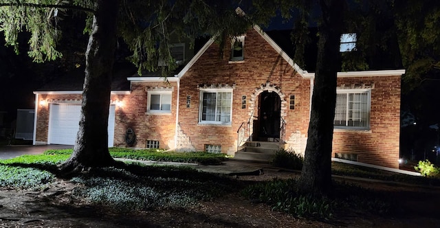 5400 Midlothian Tpke, Crestwood, IL 60418 - tudor-style house with brick siding, a garage, and asphalt driveway
