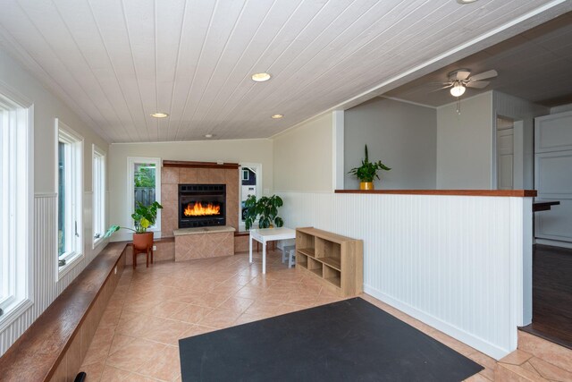 2112 Church St, Johnsburg, IL 60051 - living room featuring wood ceiling, a wainscoted wall, a tile fireplace, a ceiling fan, and recessed lighting