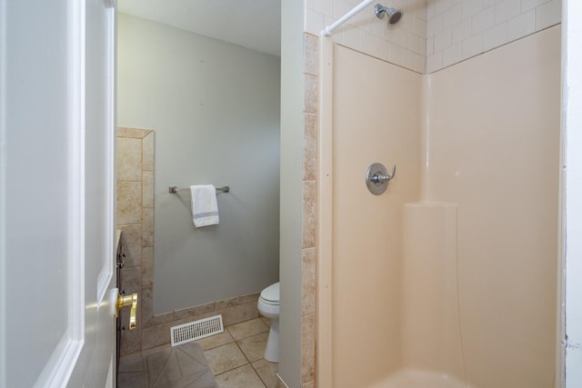 2112 Church St, Johnsburg, IL 60051 - bathroom with a shower, tile patterned flooring, and toilet