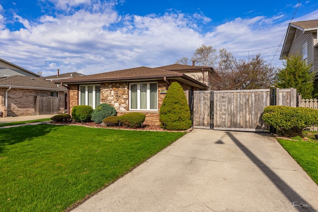 8327 S 78th Ave, Bridgeview, IL 60455 - view of front of property with a gate, driveway, and brick siding
