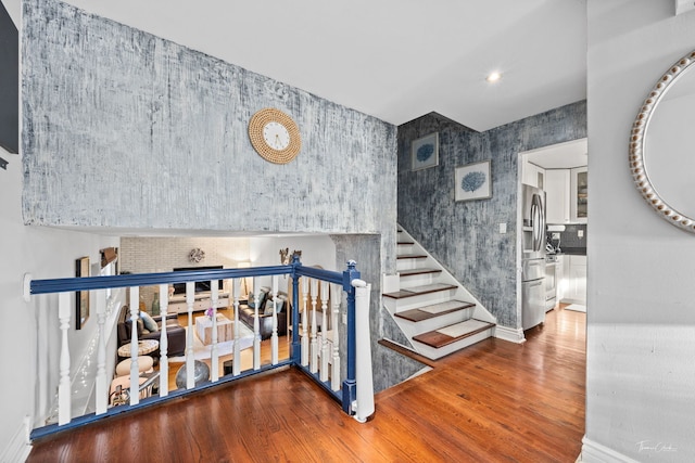 8327 S 78th Ave, Bridgeview, IL 60455 - stairs featuring wood finished floors, baseboards, and wallpapered walls