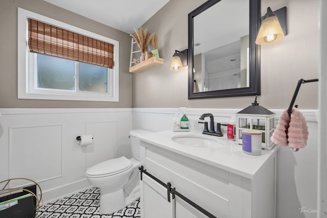 8327 S 78th Ave, Bridgeview, IL 60455 - bathroom with a wainscoted wall, vanity, toilet, and tile patterned floors