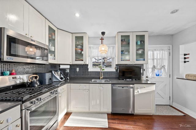8327 S 78th Ave, Bridgeview, IL 60455 - kitchen with appliances with stainless steel finishes, dark countertops, a sink, dark wood-type flooring, and recessed lighting