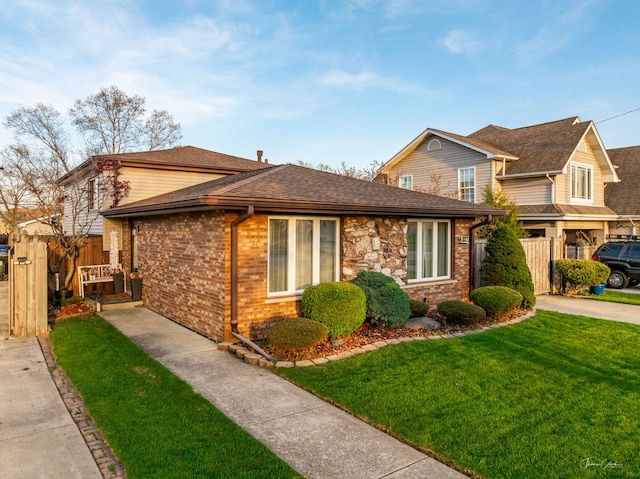 8327 S 78th Ave, Bridgeview, IL 60455 - view of front of house with a gate, brick siding, and roof with shingles