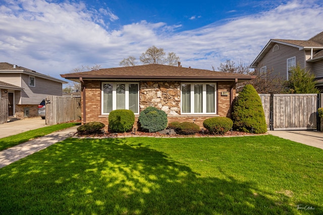 8327 S 78th Ave, Bridgeview, IL 60455 - view of front facade with driveway, brick siding, and a gate