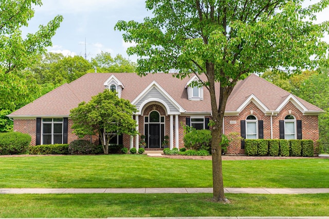 3302 Greenwood Ln, Saint Charles, IL 60175 - view of front of property featuring brick siding, a front yard, and roof with shingles