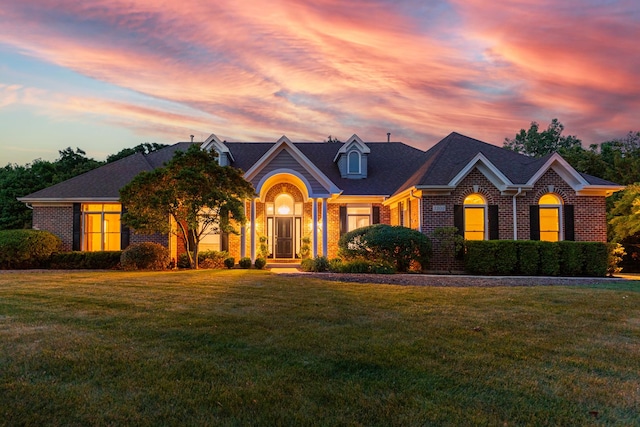 3302 Greenwood Ln, Saint Charles, IL 60175 - view of front of home with brick siding, a lawn, and a shingled roof