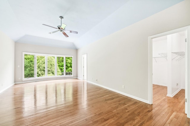 3302 Greenwood Ln, Saint Charles, IL 60175 - unfurnished living room featuring a ceiling fan, light wood-type flooring, baseboards, and lofted ceiling