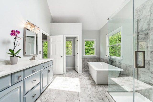 3302 Greenwood Ln, Saint Charles, IL 60175 - full bathroom with marble finish floors, double vanity, a soaking tub, vaulted ceiling, and a stall shower