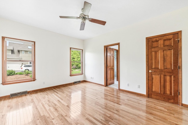 3302 Greenwood Ln, Saint Charles, IL 60175 - unfurnished bedroom featuring light wood-type flooring, baseboards, ceiling fan, and ensuite bathroom