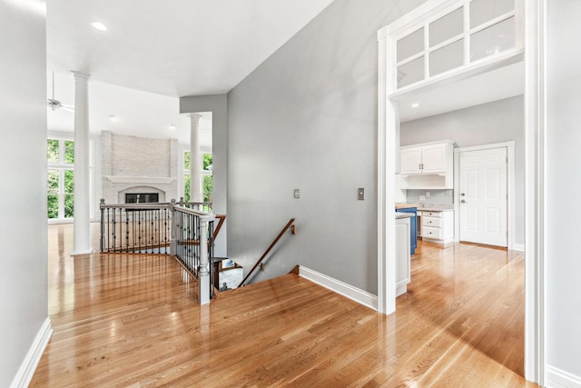 3302 Greenwood Ln, Saint Charles, IL 60175 - corridor featuring an upstairs landing, ornate columns, light wood-style floors, baseboards, and recessed lighting