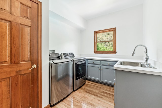 3302 Greenwood Ln, Saint Charles, IL 60175 - washroom with washer and clothes dryer, cabinet space, and light wood-style flooring