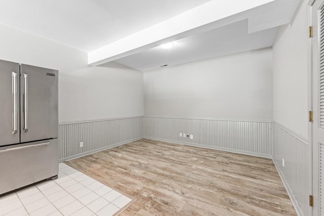 3302 Greenwood Ln, Saint Charles, IL 60175 - unfurnished dining area featuring light wood-style flooring and a wainscoted wall