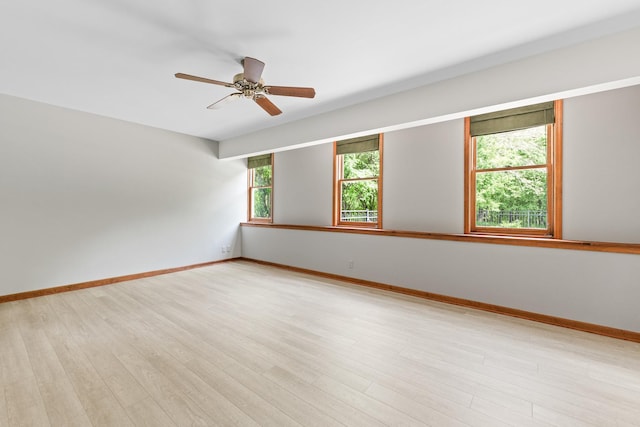 3302 Greenwood Ln, Saint Charles, IL 60175 - spare room featuring light wood-style flooring, baseboards, and ceiling fan