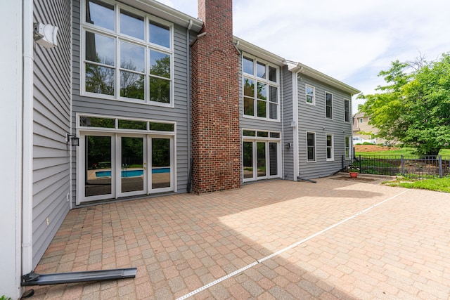 3302 Greenwood Ln, Saint Charles, IL 60175 - back of house with a patio area and a chimney
