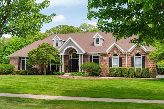 3302 Greenwood Ln, Saint Charles, IL 60175 - view of front facade featuring brick siding, a front lawn, and roof with shingles
