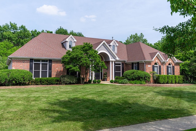 3302 Greenwood Ln, Saint Charles, IL 60175 - view of front facade featuring brick siding and a front lawn