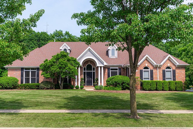 3302 Greenwood Ln, Saint Charles, IL 60175 - view of front of property featuring brick siding, a front yard, and roof with shingles