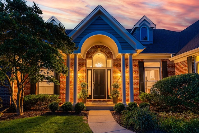 3302 Greenwood Ln, Saint Charles, IL 60175 - exterior entry at dusk with brick siding