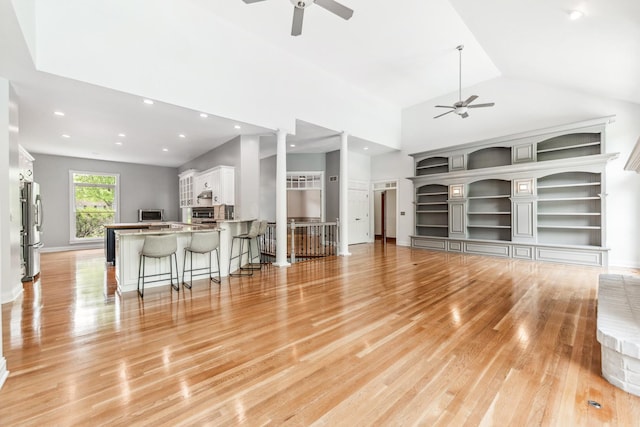 3302 Greenwood Ln, Saint Charles, IL 60175 - living room featuring a ceiling fan, light wood-type flooring, recessed lighting, vaulted ceiling, and built in features