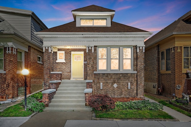 7709 S Eberhart Ave, Chicago, IL 60619 - view of front of property featuring brick siding and roof with shingles