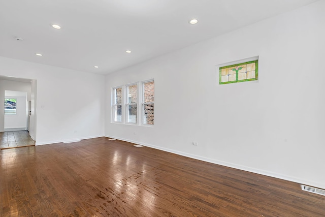 7709 S Eberhart Ave, Chicago, IL 60619 - unfurnished room with baseboards, wood finished floors, and recessed lighting