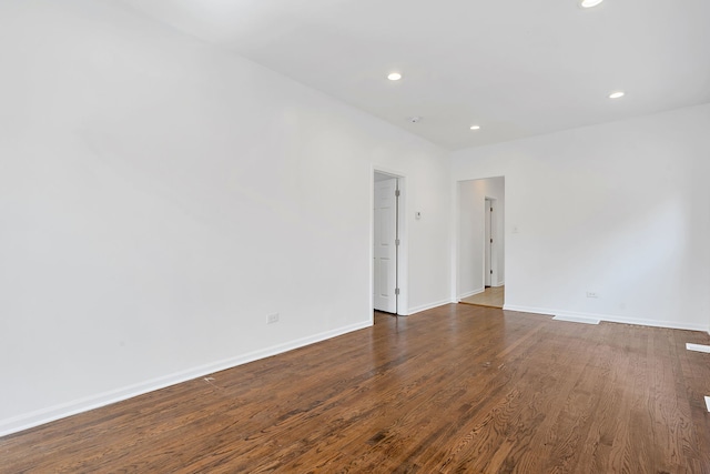 7709 S Eberhart Ave, Chicago, IL 60619 - unfurnished room with recessed lighting, baseboards, and dark wood-type flooring