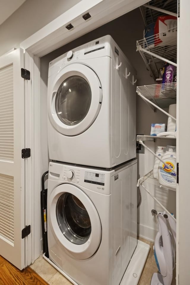 1242 W Jackson Blvd Unit 2W, Chicago, IL 60607 - clothes washing area featuring stacked washer / drying machine and light tile patterned floors