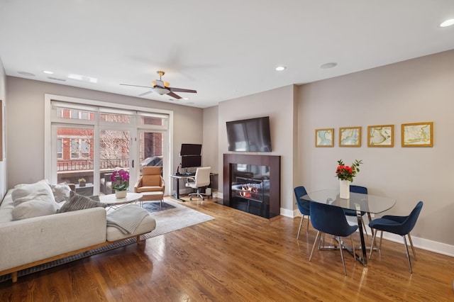 1242 W Jackson Blvd Unit 2W, Chicago, IL 60607 - living room with wood finished floors, ceiling fan, baseboards, and recessed lighting