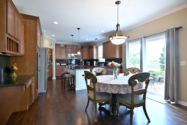 13464 Skyline Dr, Plainfield, IL 60585 - dining area featuring crown molding, dark wood finished floors, and recessed lighting