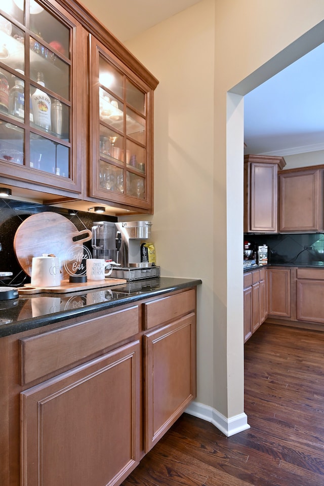 13464 Skyline Dr, Plainfield, IL 60585 - bar area with dark wood finished floors, tasteful backsplash, and baseboards
