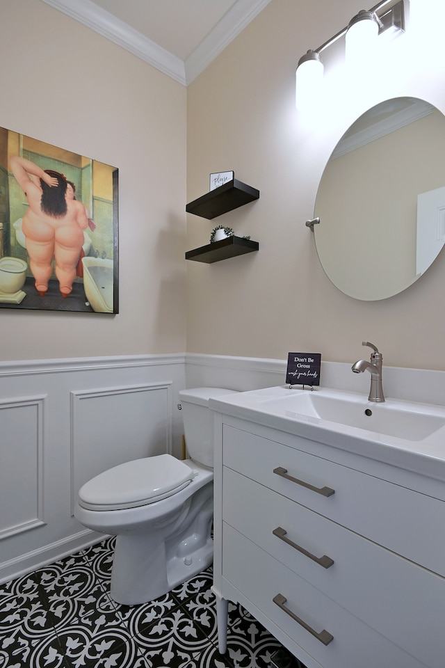 13464 Skyline Dr, Plainfield, IL 60585 - half bath featuring ornamental molding, toilet, a wainscoted wall, vanity, and a decorative wall