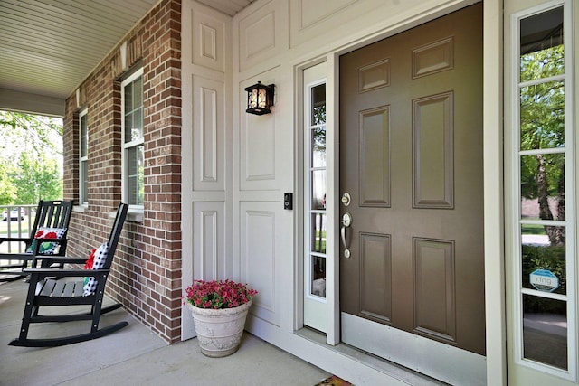 13464 Skyline Dr, Plainfield, IL 60585 - doorway to property with a porch and brick siding