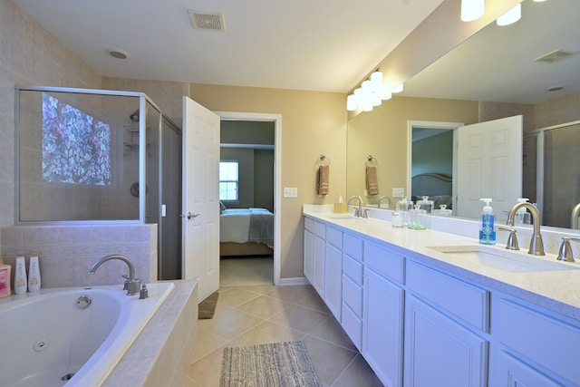 13464 Skyline Dr, Plainfield, IL 60585 - full bath featuring connected bathroom, double vanity, a shower stall, a tub with jets, and tile patterned flooring
