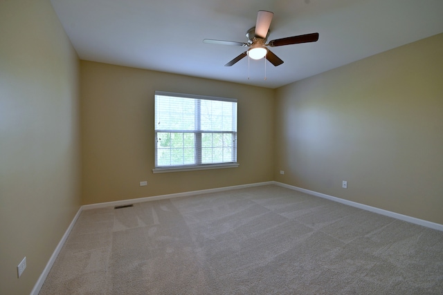 13464 Skyline Dr, Plainfield, IL 60585 - empty room featuring ceiling fan, baseboards, and light colored carpet