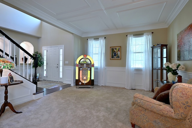 13464 Skyline Dr, Plainfield, IL 60585 - entryway featuring stairway, a decorative wall, carpet floors, wainscoting, and ornamental molding