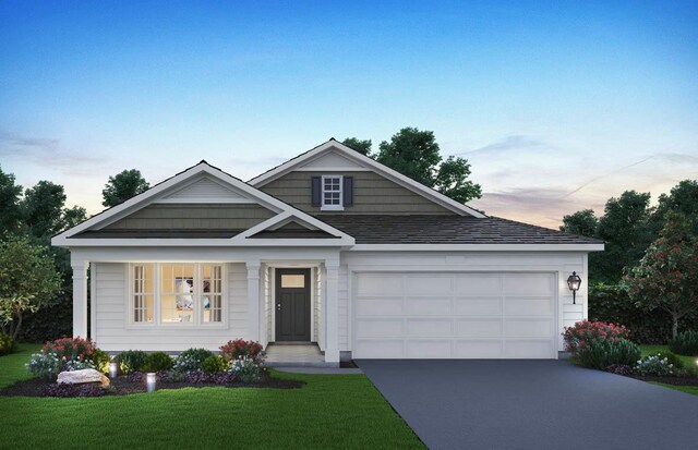 2279 Redwood Trl, Wonder Lake, IL 60097 - view of front of property with driveway, a front yard, and an attached garage